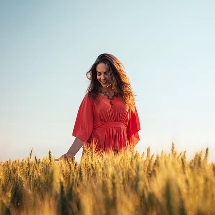 Happy Woman Walking In A Wheat Field, Angelite Uses and Benefits