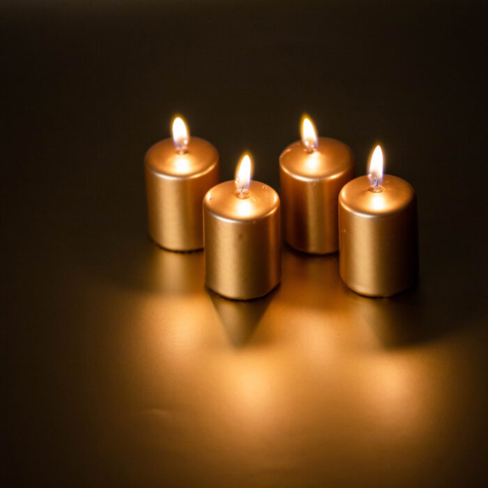 Four golden Candles burning