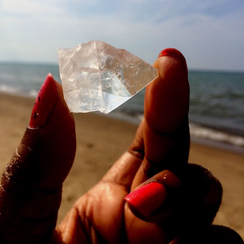hand holding apophyllite crystal