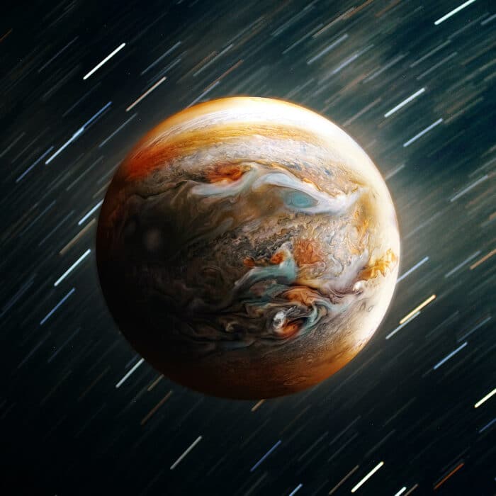The planet Jupiter with a starry falling stars background