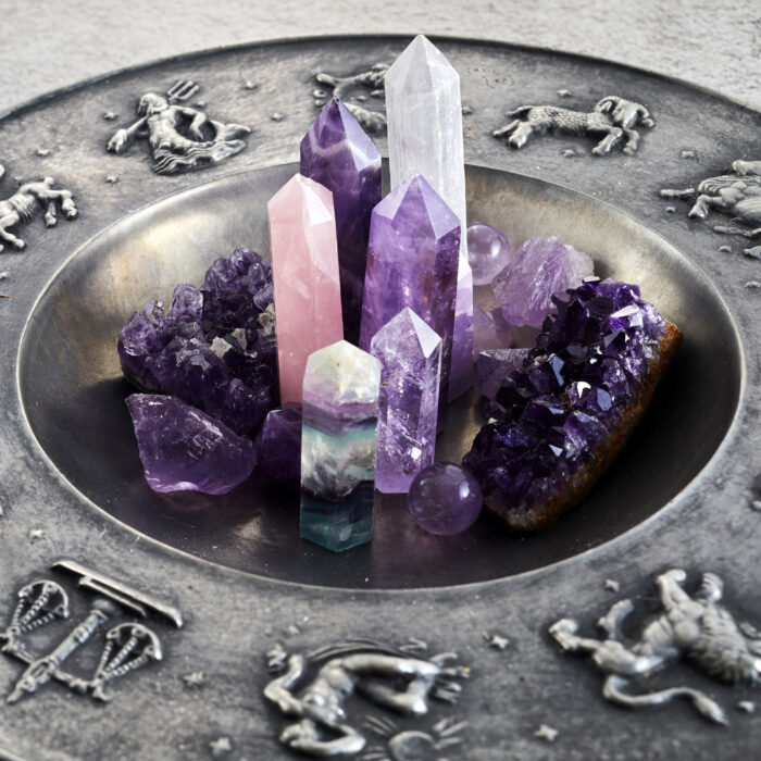 Crystals for healing, fortune telling and astrologhy circle on grey background. Esoteric and life coaching concept
