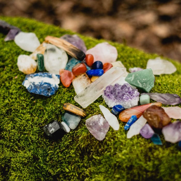healing crystals on mossy rock