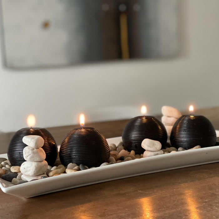 Black candles with stones