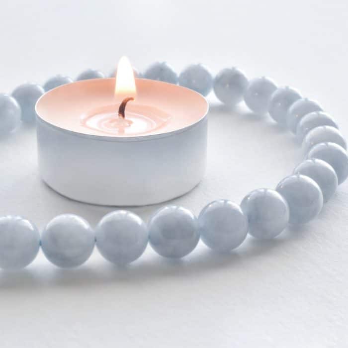 aquamarine beads with lighted candle