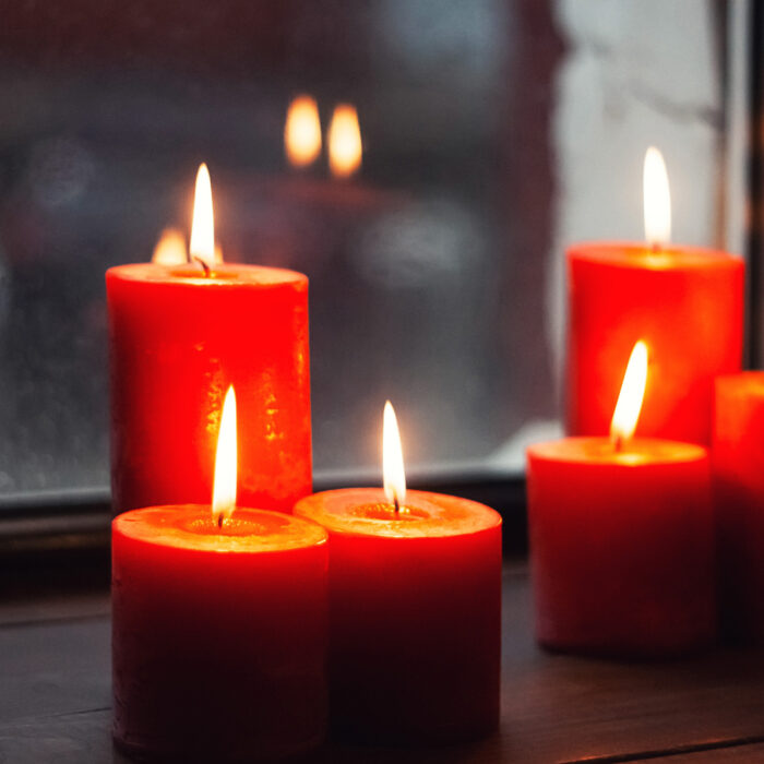 Red candles by the window