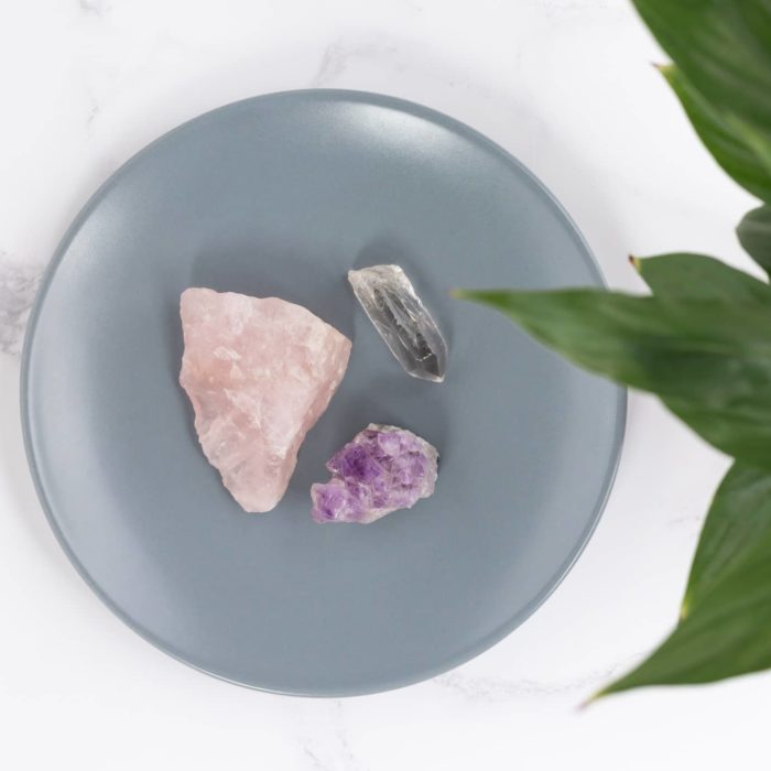 healing crystals on a grey plate