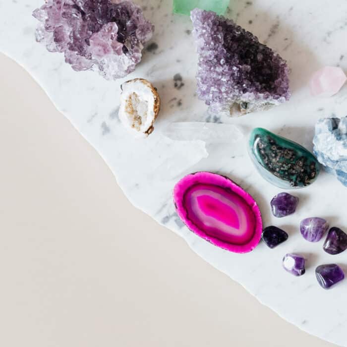Colorful healing crystals on a marble countertop