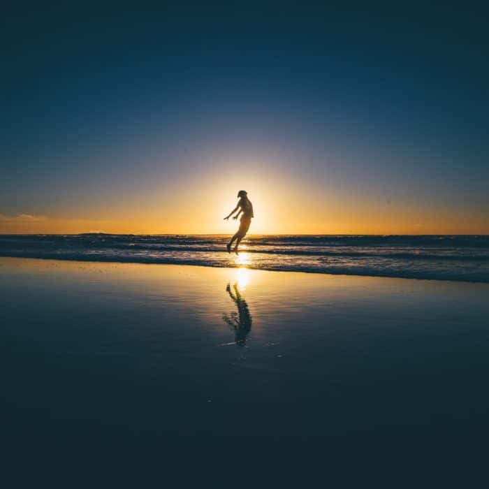 person transcending on the beachside