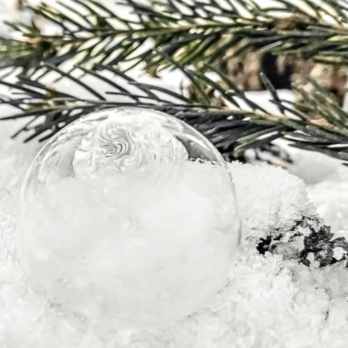 frozen bubble with ice crystals on snow
