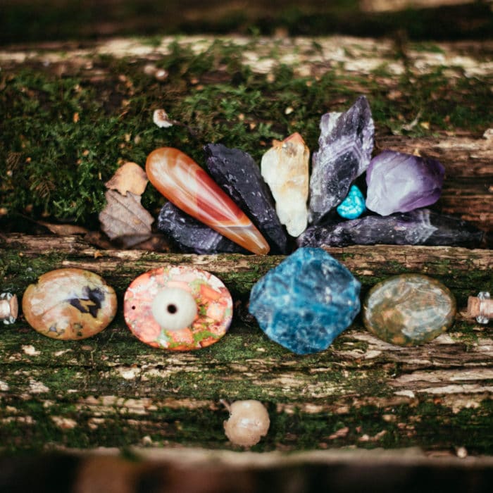 healing crystals on a mossy piece of wood