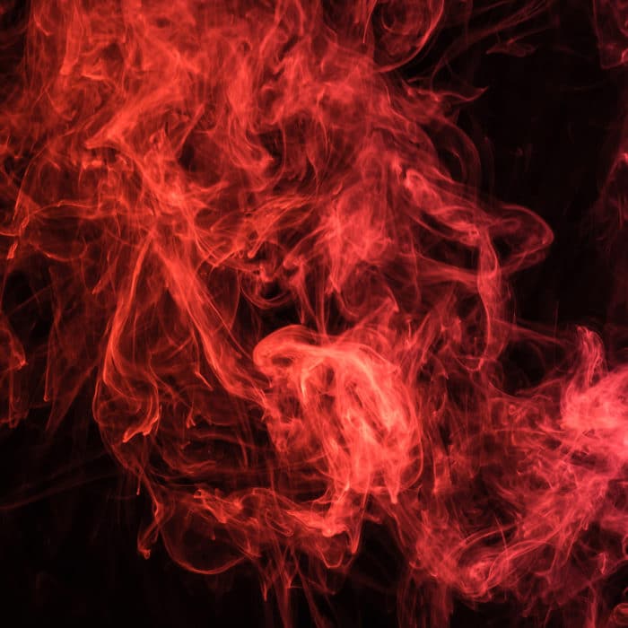 red mystical smoke on black background