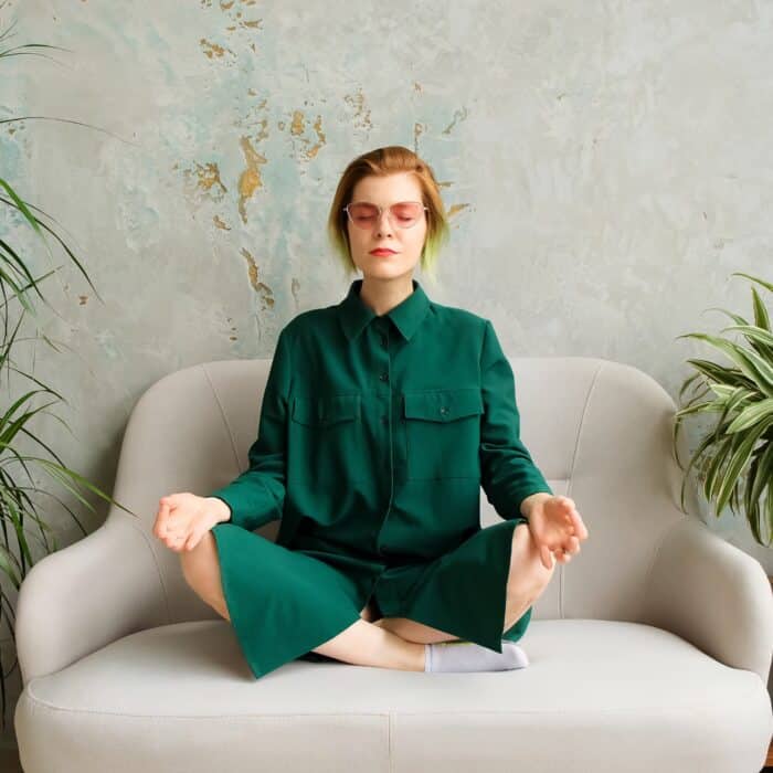 Woman meditating indoors
