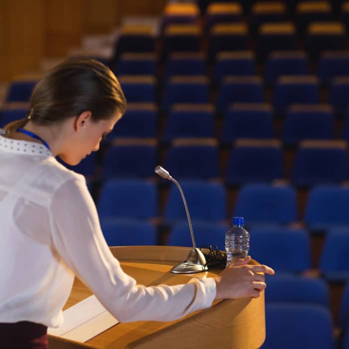 Woman Preparing Speech In Auditorium