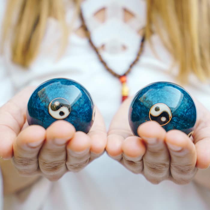 Chinese balls Yin Yan in hand balance, natural healing concept