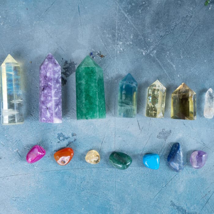 Gemstones minerals obelisks row over gray background. Magic healing Rock for Reiki Crystal Ritual, Witchcraft, spiritual esoteric practice