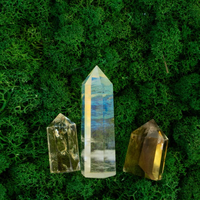 Gemstones minerals mix on mysterious natural forest moss background, quartz and calcite crystals top view . Magic healing Rock for Reiki Crystal Ritual, Witchcraft