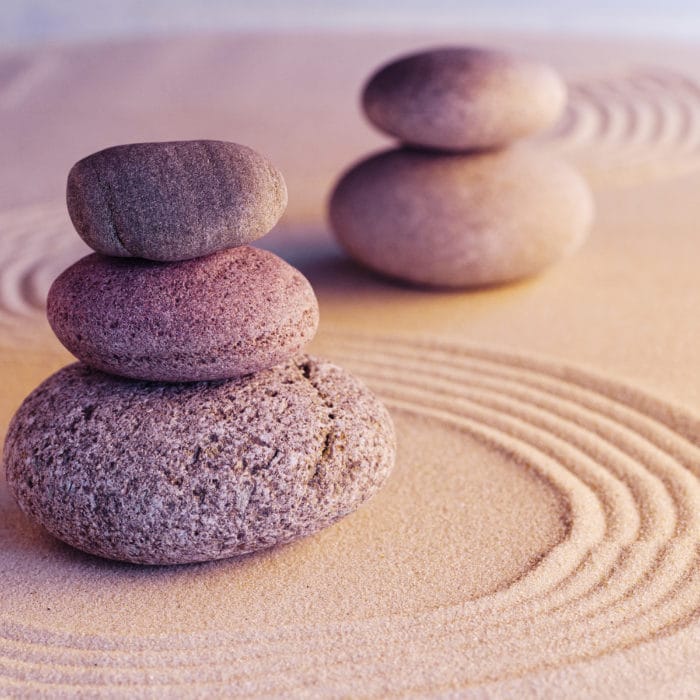 Meditation zen garden with stones on sand, toned picture