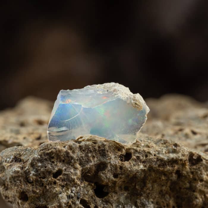 Raw Uncut Piece of Opal Mineral Stone. Geology Gem Crystal Collection on Natural Background
