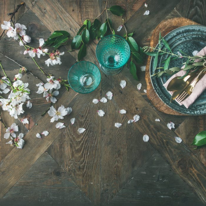 Flat-lay of Spring Easter Table setting with almond blossom flowers