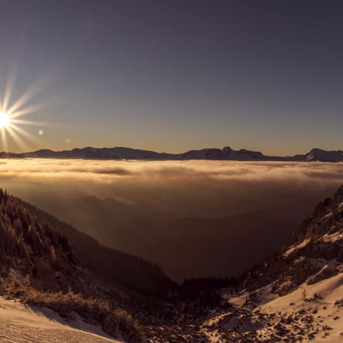 sunrise in the mountains with mystic fog