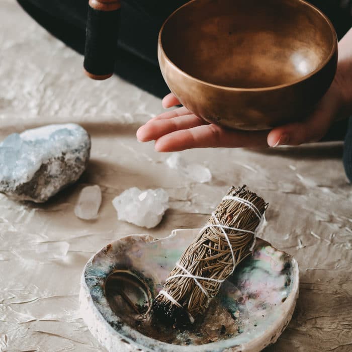 Crystal cleansing ritual, smudging, sound, and singing bowl