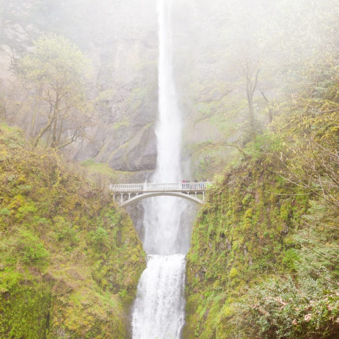 Famous landmark of Multnomah Falls and Benson Footbridge on rainy day in Columbia River valley near Portland, Oregon, USA