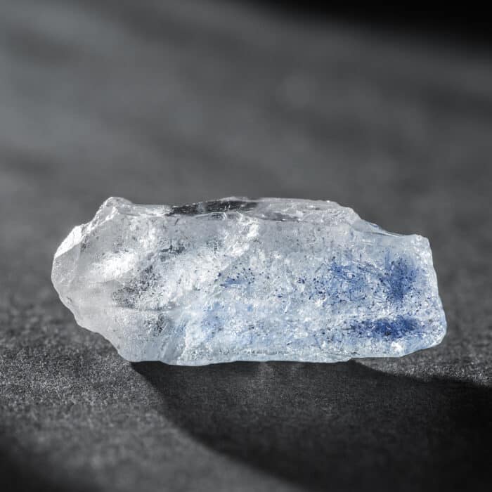Quartz with Rare Blue Dumortierite Inclusions Mineral Crystal Stone on Dark Background. Healing Crystals and Minerals Collection