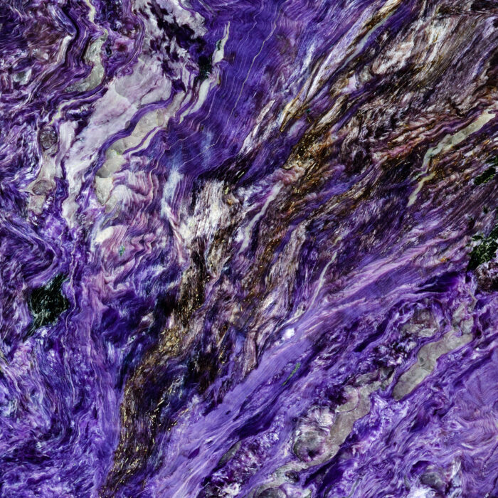 Backgrounds and textures: surface of beautiful purple decorative stone, abstract pattern of swirls, twirls, lines, cracks, spots and stains, natural background
