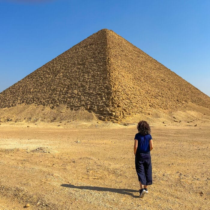 Woman standing near the pyramid in Egypt