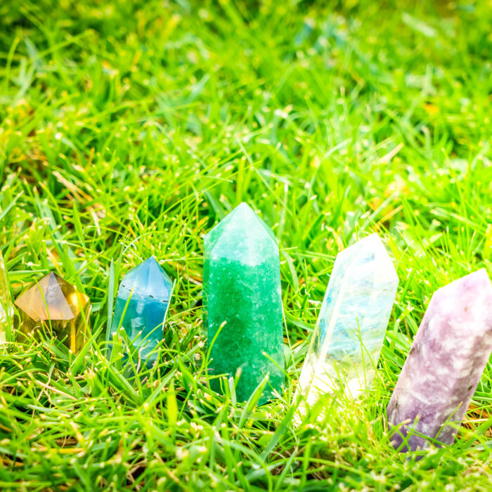 Set of chakra stones in grass. Magic healing Rock for Reiki Crystal Ritual, Witchcraft, spiritual esoteric practice