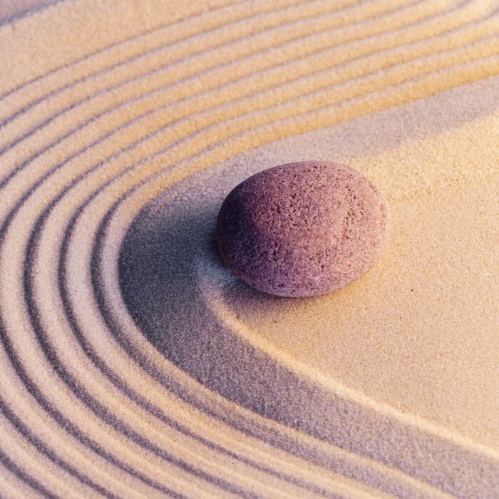 Meditation zen garden with stones on sand, toned picture