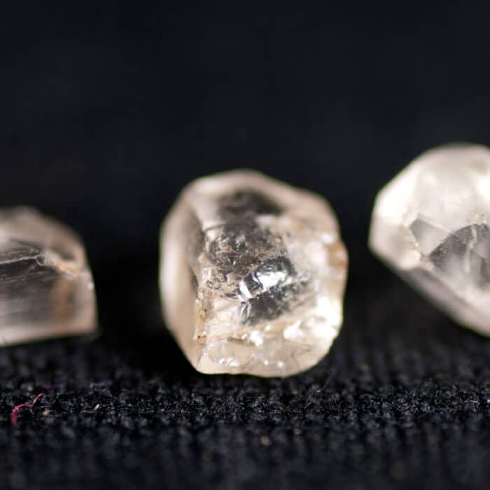 Small flawed white diamonds not gem stone quality with occlusions