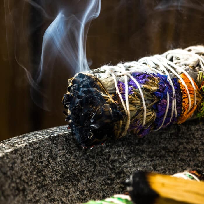 Smudge Ritual Burning Sage Stick. Spiritual Meditation and Yoga Ritual.