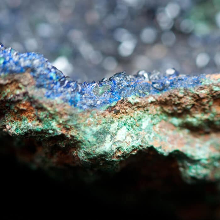 A vibrant blue azurite mineral sample on a black background