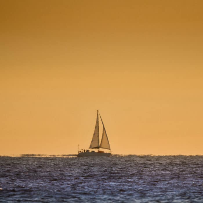 A boat on the horizon