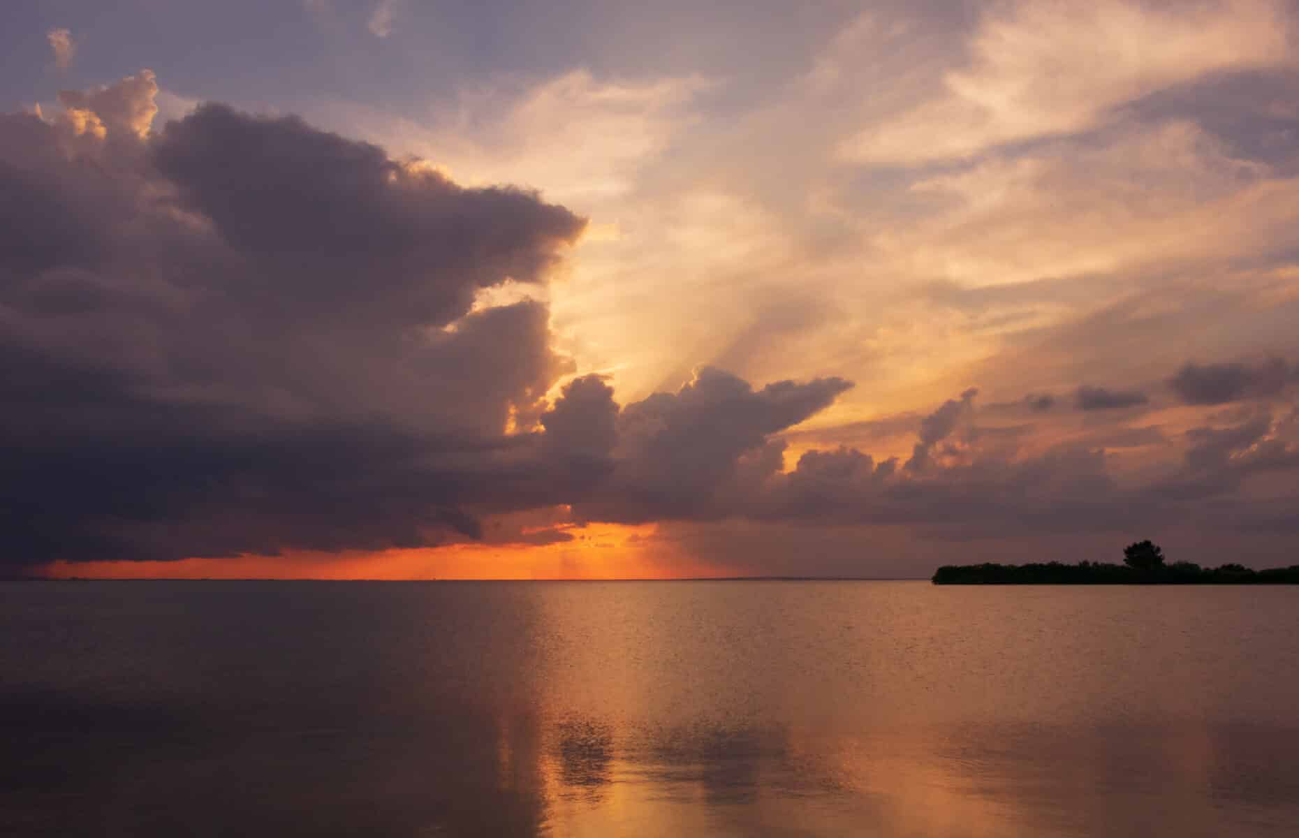 A scenery of sunset in a calm ocean