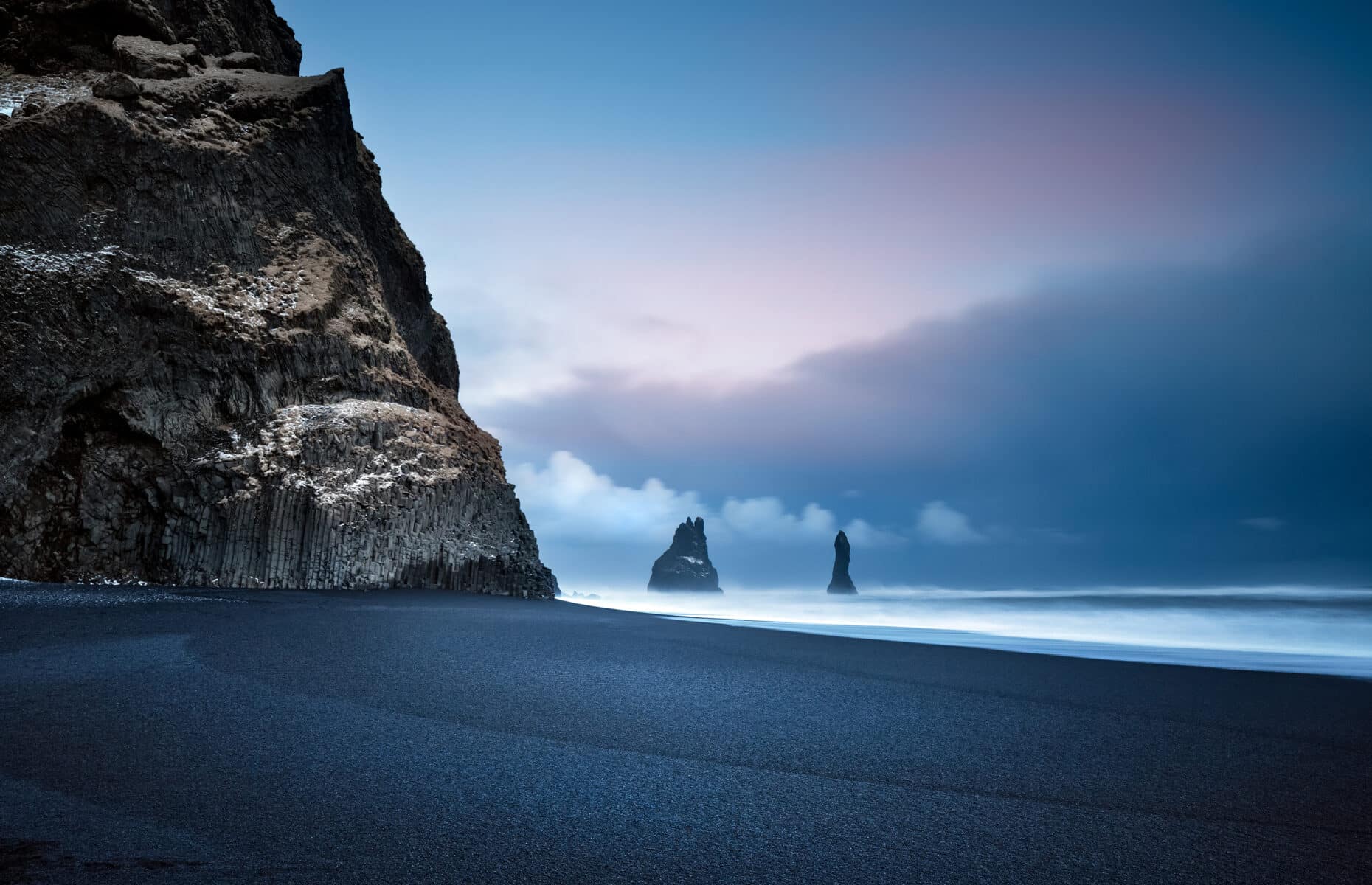 Beautiful Landscape of a Famous Black Pebbles Beach. Amazing View on the Basalt Cliffs in the Sea. Vik Myrdal. Iceland