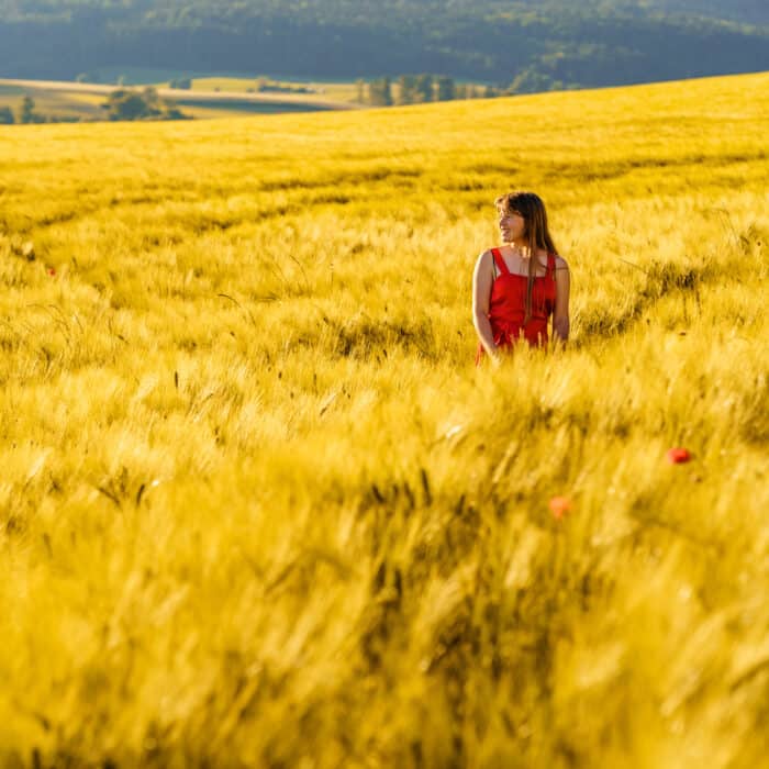 Happy teenager in a barley field