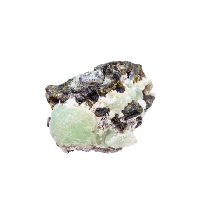 Closeup of sample of natural mineral from geological collection - rough Prehnite stone in Epidote crystals isolated on white background