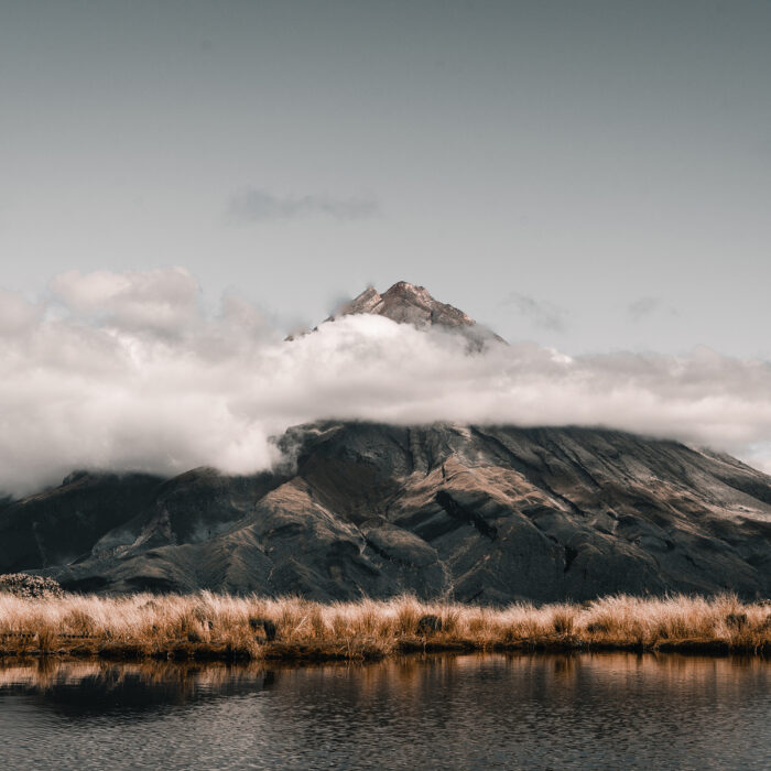 Landscape view of mountain peak and huge cloud in Taranaki, New Zealand