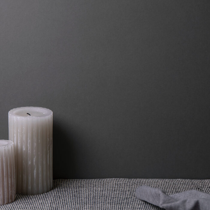 Gray candles on a gray background