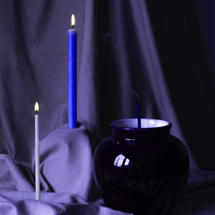 Two candles, white and indigo
