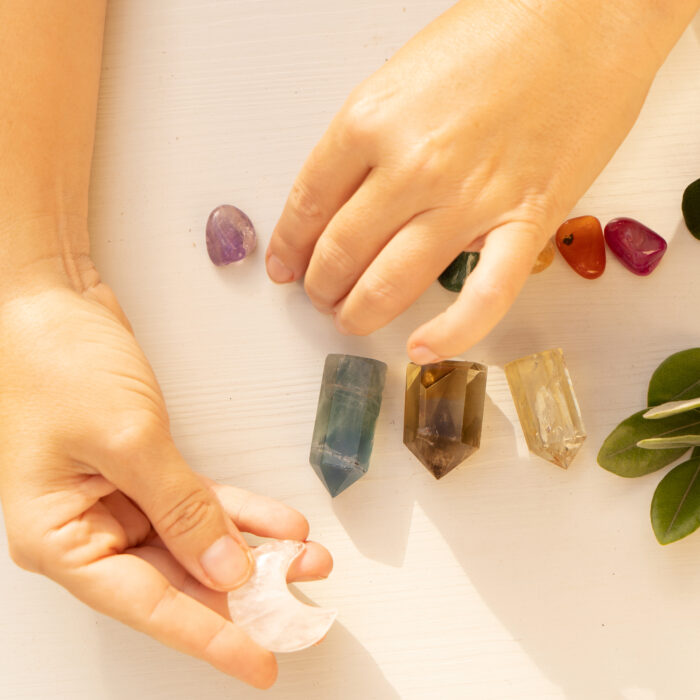 Gemstones minerals stones and obelisks with herbs. Hands holding moon. Witchcraft, herbal medicine and healing, Magic healing Rock for Reiki Crystal Ritual, Witchcraft, spiritual esoteric practice